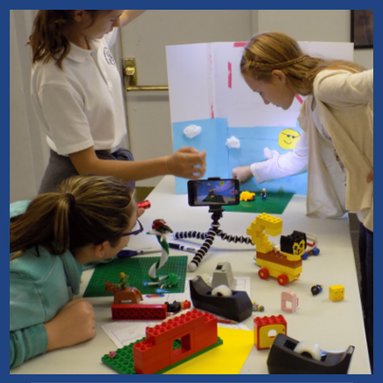 three teen girls filming a stop motion video