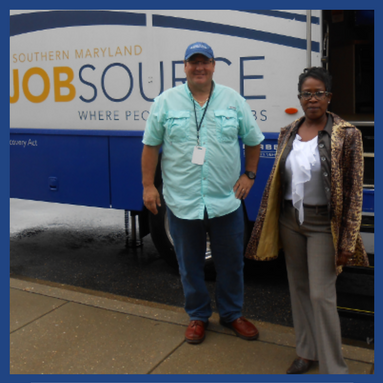 JobSource Mobile Career Center van with man and woman standing in front of it