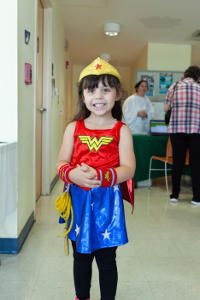 young girl dressed as wonder woman
