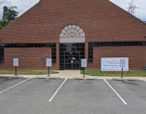 front of library with four marked parking spots