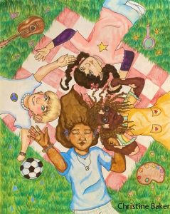 four girls lying on a picnic blanket