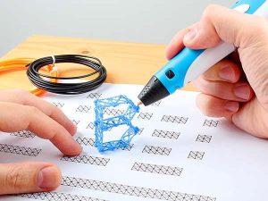 Hand holding a blue 3D pen, creating a 3D box, with extra filament to the side