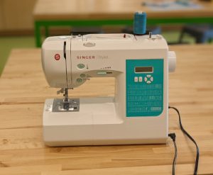 White singer stylist sewing machine with turquoise accents