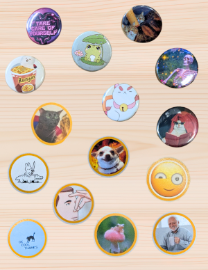 A selection of colorful pin buttons with different characters, animals, sentiments, reaction memes, and silly faces.