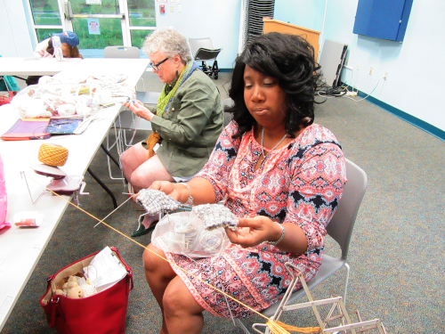 photo of 2 women knitting and crocheting