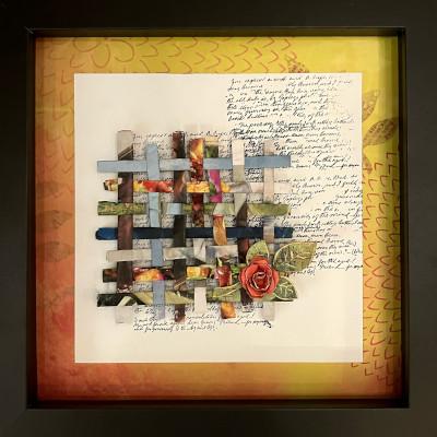 A framed art piece featuring scraps of fabric woven together