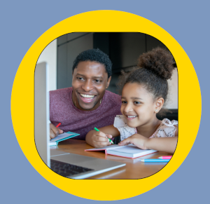 A man and a little girl smiling, sitting in front of a laptop. The girl is also writing in a notebook.